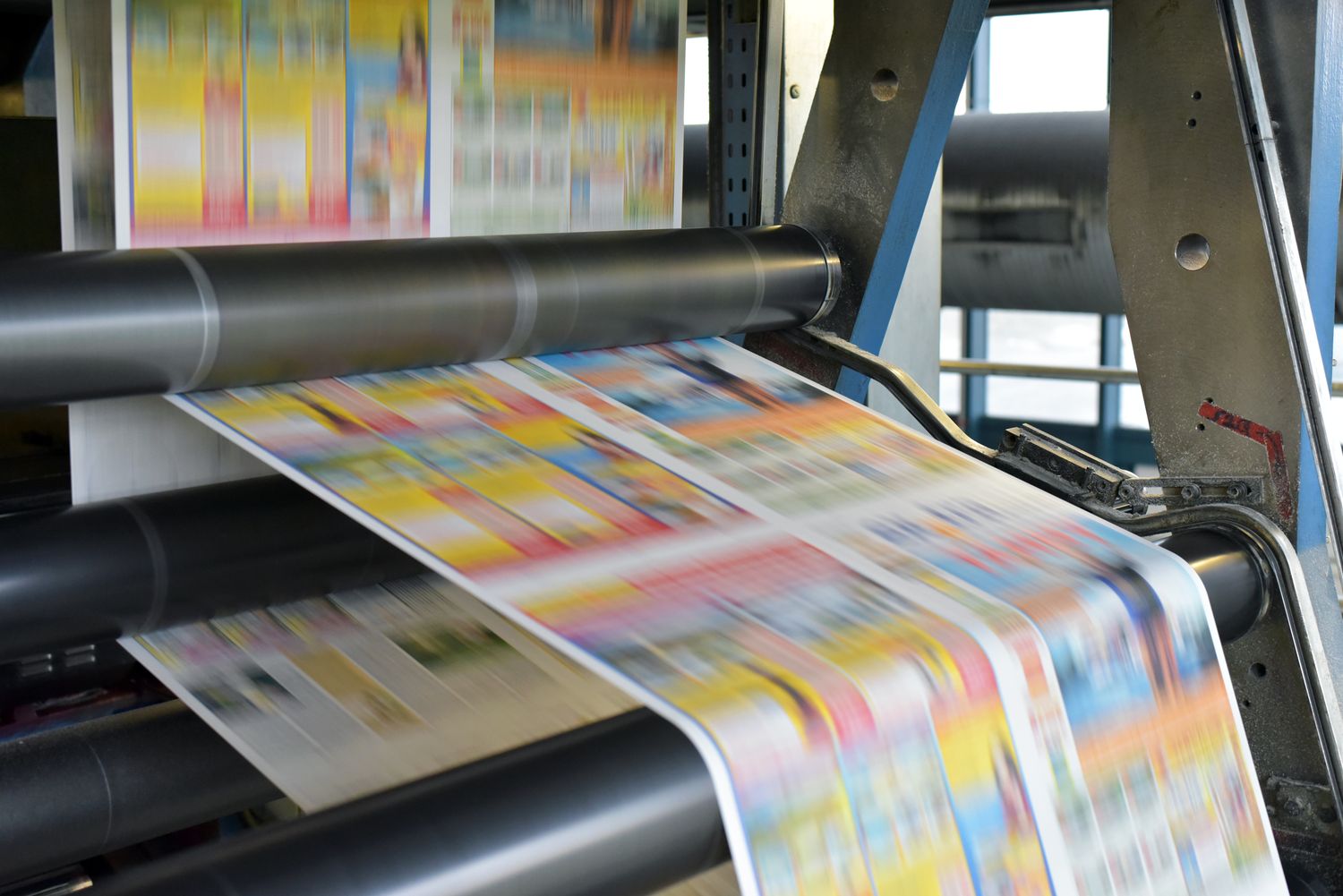 A printer loading paper. Craft and quality.