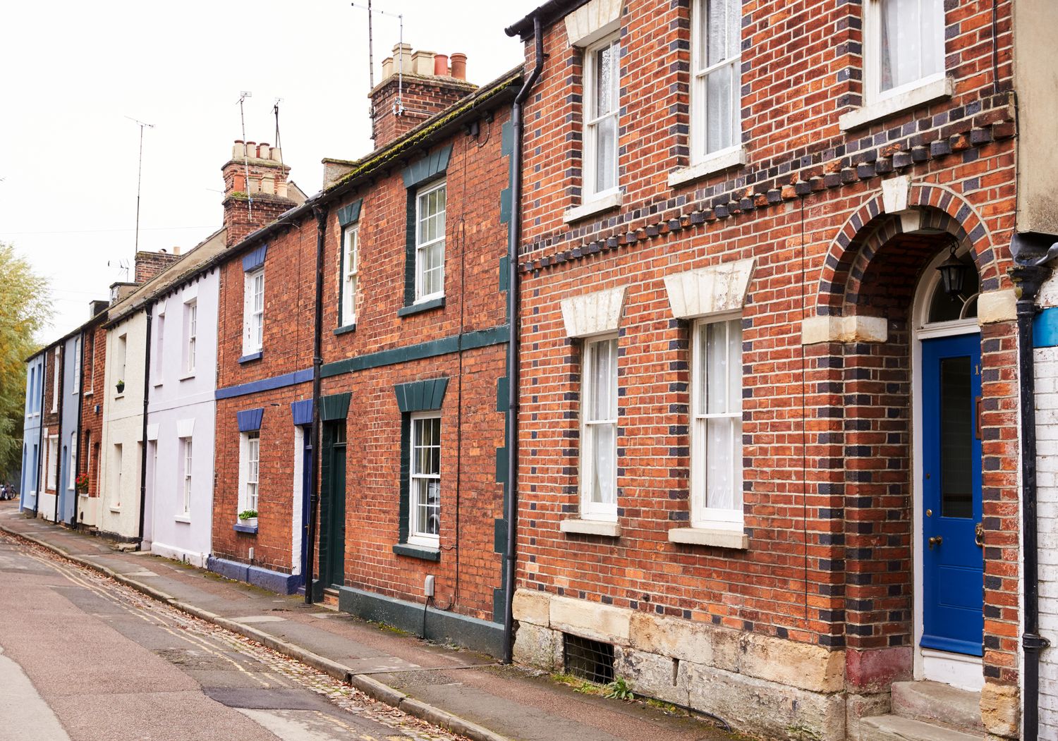 A UK street of mixed housing, or a mover timeline visual: pre, on, post.