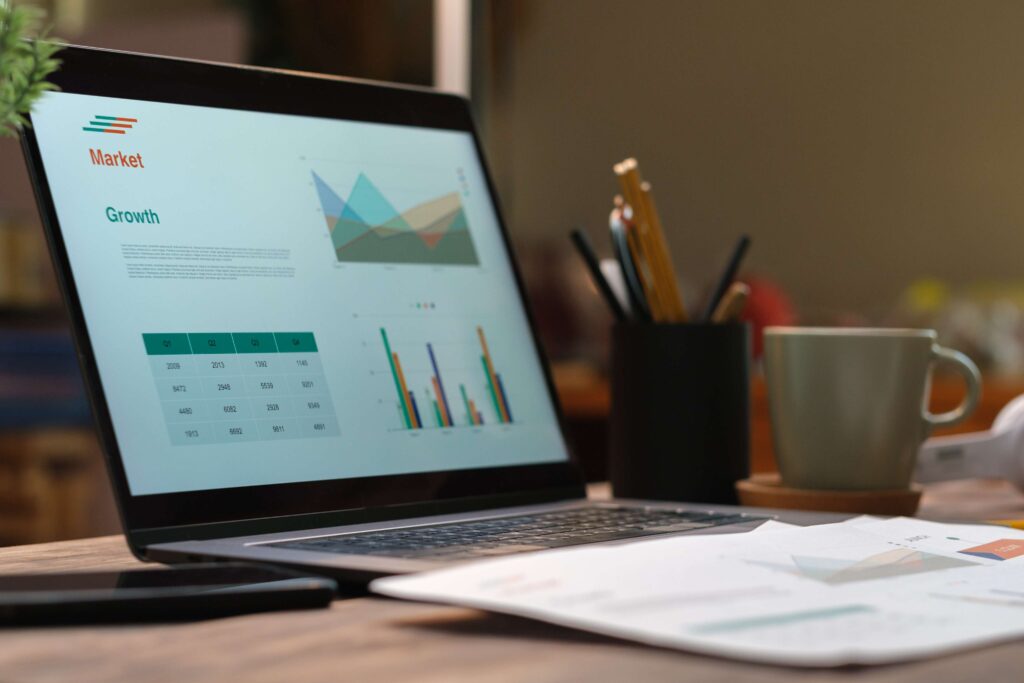 Laptop with paperwork on wood table in living room 2024 12 05 14 11 47 utc